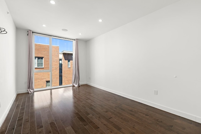 5 Washington Pl, Cliffside Park, NJ 07010 - spare room with baseboards, dark wood-style floors, recessed lighting, and floor to ceiling windows