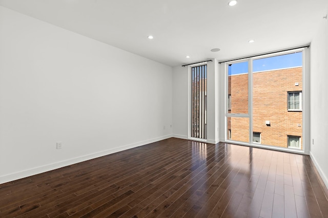 5 Washington Pl, Cliffside Park, NJ 07010 - unfurnished room with dark wood finished floors, baseboards, floor to ceiling windows, and recessed lighting