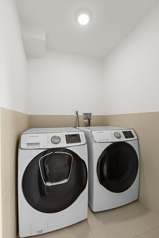 5 Washington Pl, Cliffside Park, NJ 07010 - washroom with washing machine and dryer, light tile patterned floors, and laundry area