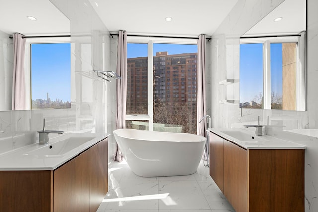 5 Washington Pl, Cliffside Park, NJ 07010 - full bathroom featuring a freestanding bath, two vanities, and a sink