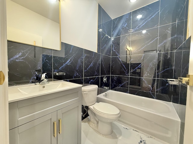 full bathroom with toilet, bathtub / shower combination, tile walls, and vanity