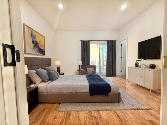 bedroom featuring light wood-type flooring, access to outside, and recessed lighting