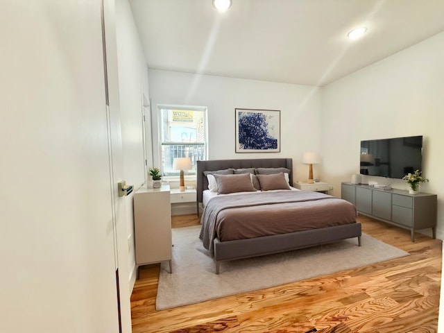 bedroom with light wood-style flooring and recessed lighting