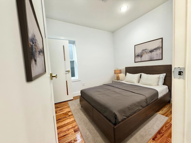 bedroom featuring light wood finished floors