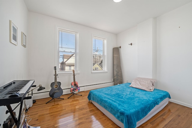 bedroom with hardwood / wood-style flooring