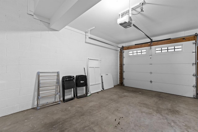 405 Commercial Ave, Cliffside Park, NJ 07010 - garage with a garage door opener and concrete block wall