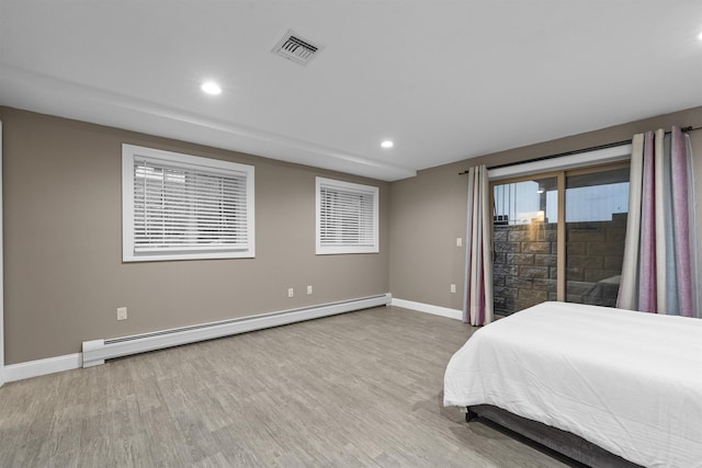 405 Commercial Ave, Cliffside Park, NJ 07010 - bedroom featuring baseboard heating, access to outside, recessed lighting, and wood finished floors