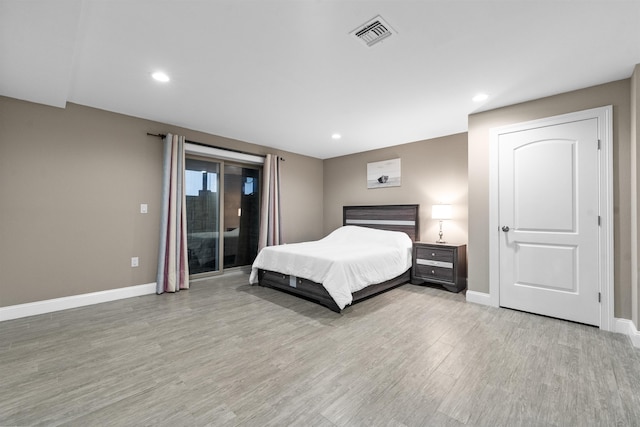 405 Commercial Ave, Cliffside Park, NJ 07010 - bedroom with access to outside, light wood-style flooring, and recessed lighting