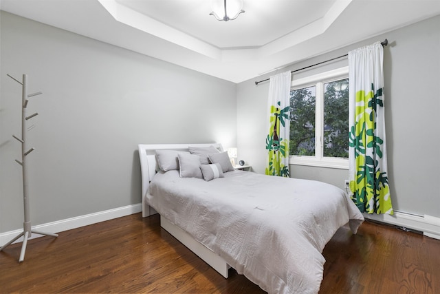 405 Commercial Ave, Cliffside Park, NJ 07010 - bedroom featuring a raised ceiling and wood finished floors
