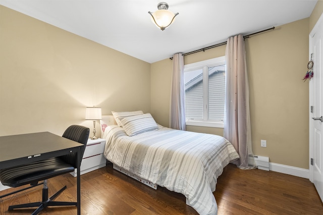 405 Commercial Ave, Cliffside Park, NJ 07010 - bedroom featuring a baseboard heating unit and wood finished floors