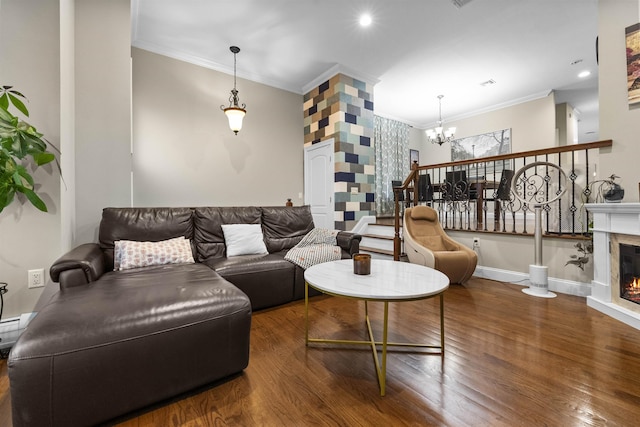 405 Commercial Ave, Cliffside Park, NJ 07010 - living area featuring ornamental molding, a chandelier, a glass covered fireplace, wood finished floors, and recessed lighting