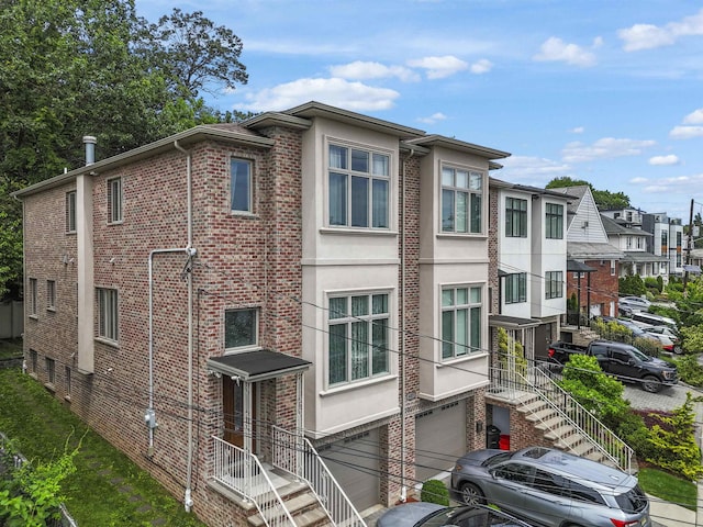 405 Commercial Ave, Cliffside Park, NJ 07010 - view of property featuring a garage and stairs
