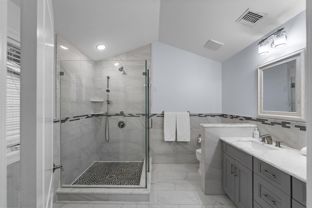 405 Commercial Ave, Cliffside Park, NJ 07010 - bathroom with tile walls, marble finish floors, a shower stall, vanity, and recessed lighting