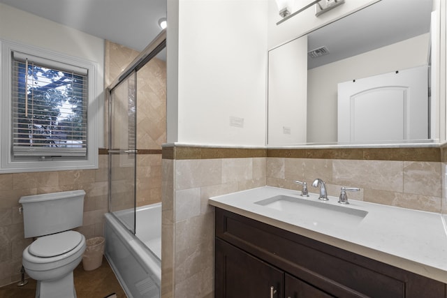 405 Commercial Ave, Cliffside Park, NJ 07010 - full bath with tile walls, vanity, and bath / shower combo with glass door
