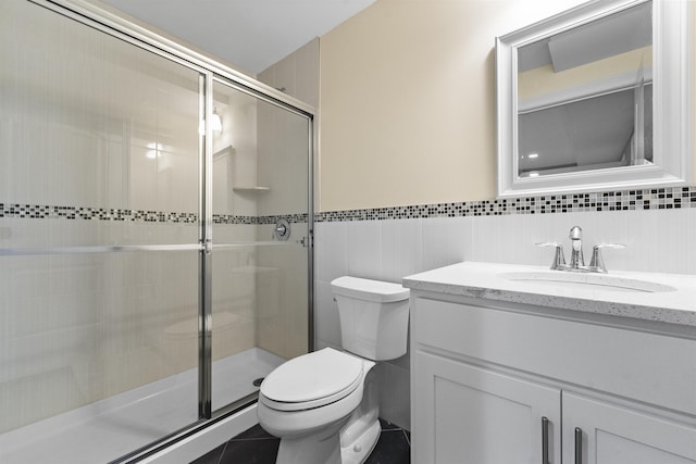 405 Commercial Ave, Cliffside Park, NJ 07010 - full bath with tile walls, vanity, a stall shower, and wainscoting
