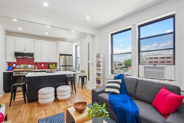 527 34th St Unit D1, Union City, NJ 07087 - living area with light wood-style flooring, recessed lighting, and cooling unit