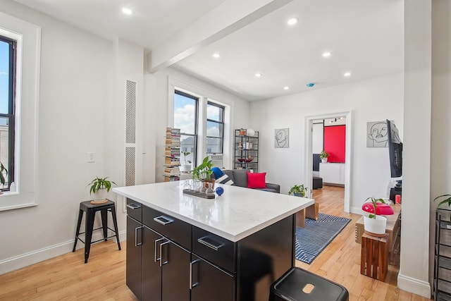 527 34th St Unit D1, Union City, NJ 07087 - kitchen featuring light wood finished floors, a kitchen island, light countertops, recessed lighting, and baseboards