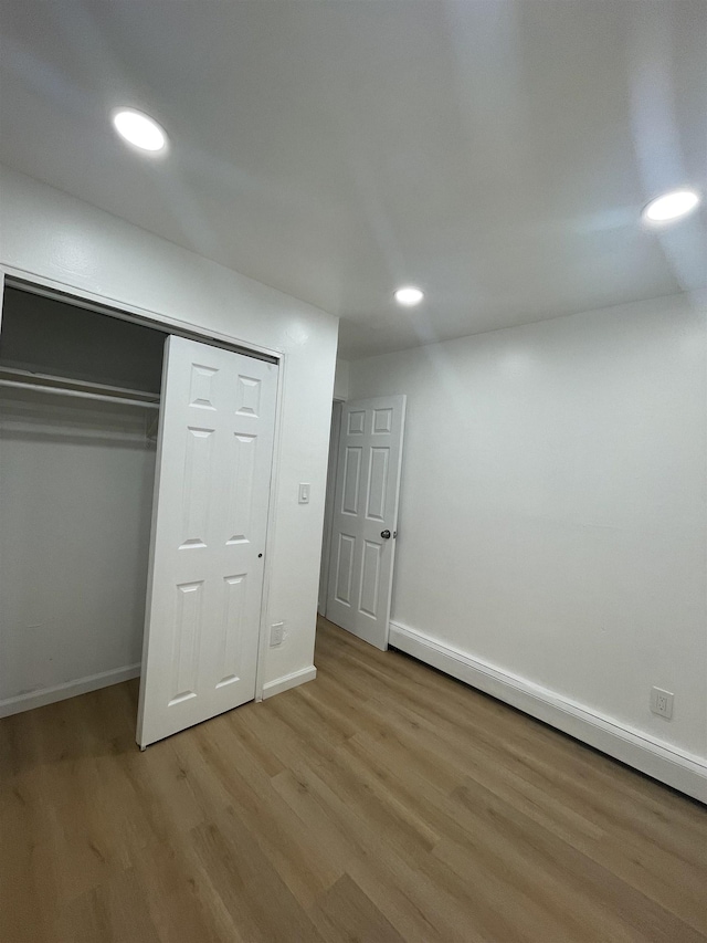 2200 Paterson Plank Rd Unit 25, North Bergen, NJ 07047 - unfurnished bedroom with wood finished floors, recessed lighting, and a closet