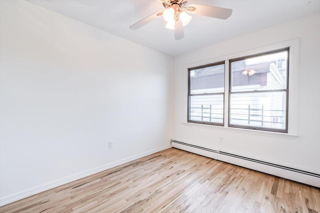 unfurnished room featuring ceiling fan, light hardwood / wood-style floors, and a baseboard radiator