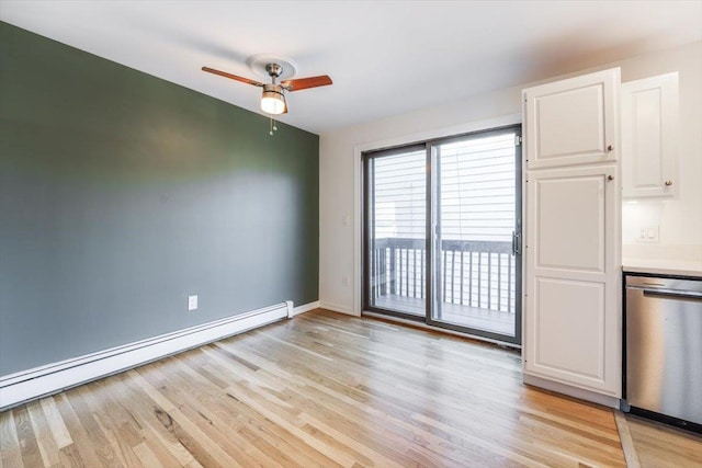 unfurnished dining area featuring ceiling fan, a baseboard radiator, and light hardwood / wood-style flooring