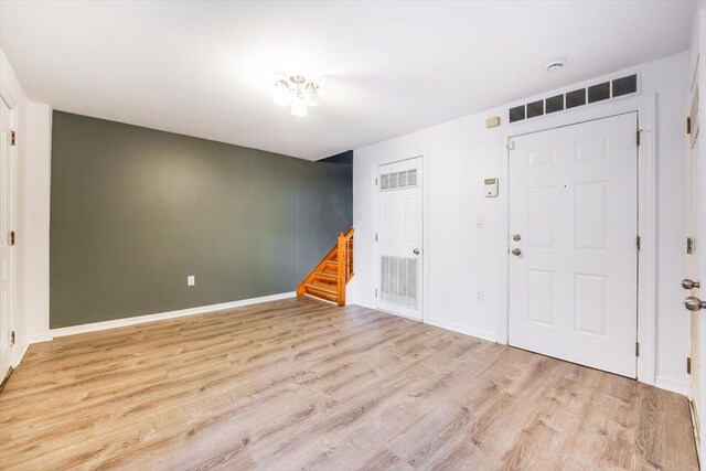 foyer with light hardwood / wood-style floors