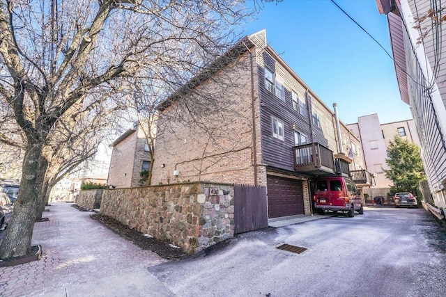 view of side of property featuring a garage