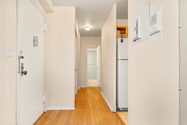 hall with light wood-style flooring
