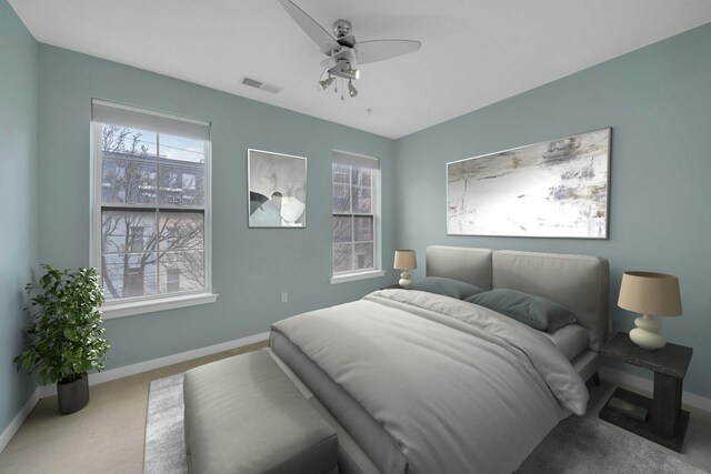 443 2nd St Unit 0212, Jersey City, NJ 07302 - carpeted bedroom with baseboards, ceiling fan, visible vents, and multiple windows