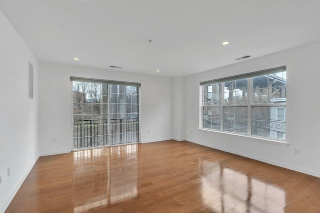 443 2nd St Unit 0212, Jersey City, NJ 07302 - unfurnished room featuring baseboards, recessed lighting, wood finished floors, and visible vents