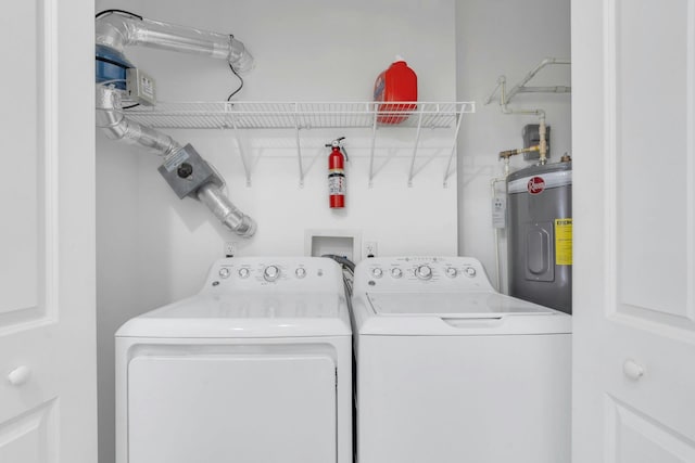 443 2nd St Unit 0212, Jersey City, NJ 07302 - clothes washing area with laundry area, washing machine and clothes dryer, and electric water heater