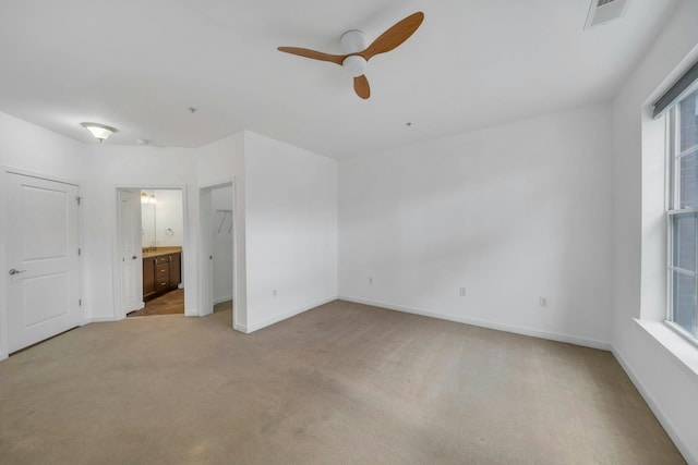 443 2nd St Unit 0212, Jersey City, NJ 07302 - unfurnished bedroom with baseboards, visible vents, connected bathroom, and light colored carpet