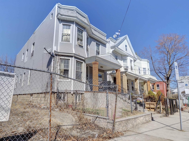 view of property exterior featuring a fenced front yard