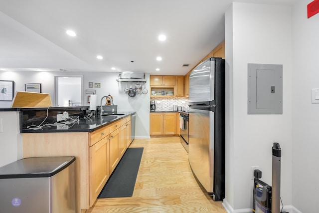 700 1st St Unit 11M, Hoboken, NJ 07030 - kitchen with appliances with stainless steel finishes, electric panel, a peninsula, light wood-style floors, and recessed lighting