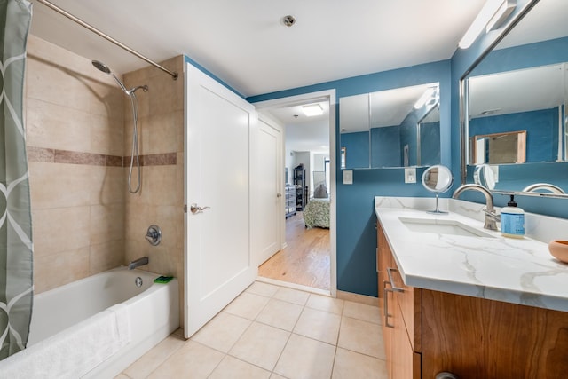 700 1st St Unit 11M, Hoboken, NJ 07030 - ensuite bathroom with shower / bath combo with shower curtain, vanity, and tile patterned flooring