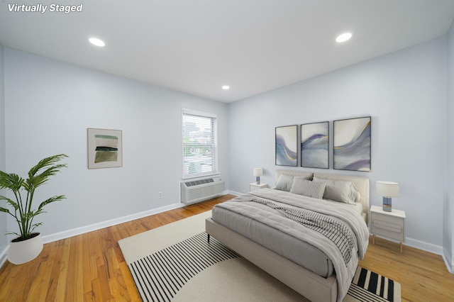 6715 Polk St Unit 12, Guttenberg, NJ 07093 - bedroom with cooling unit, light wood-style flooring, and recessed lighting