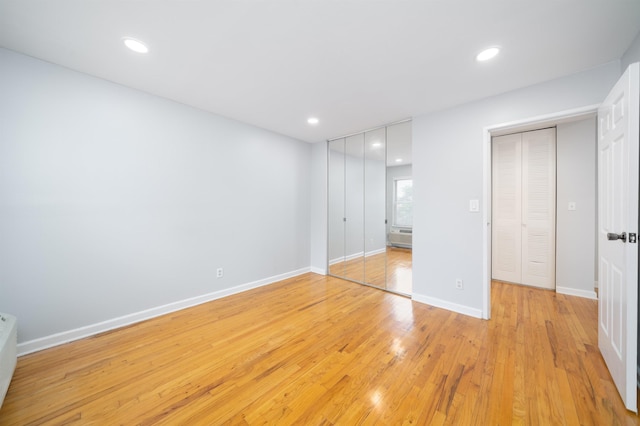 6715 Polk St Unit 12, Guttenberg, NJ 07093 - unfurnished bedroom featuring light wood finished floors and recessed lighting