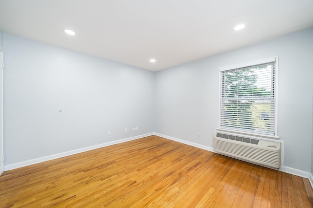 6715 Polk St Unit 12, Guttenberg, NJ 07093 - unfurnished room with light wood-style flooring, an AC wall unit, and recessed lighting
