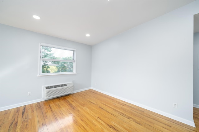 6715 Polk St Unit 12, Guttenberg, NJ 07093 - spare room featuring light wood finished floors, a wall mounted air conditioner, and recessed lighting