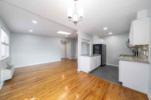 6715 Polk St Unit 12, Guttenberg, NJ 07093 - kitchen featuring stainless steel appliances, light wood-type flooring, open floor plan, white cabinets, and recessed lighting