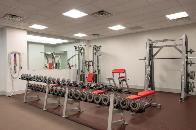 exercise room featuring a paneled ceiling