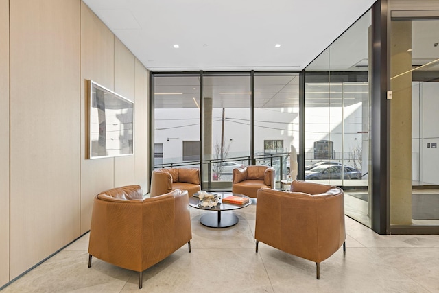 community lobby featuring a wall of windows