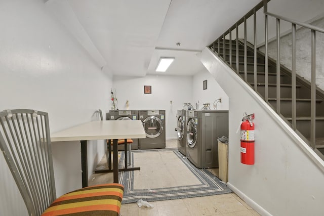 502 Central Ave Unit D1, Jersey City, NJ 07307 - communal laundry room with washing machine and clothes dryer and baseboards