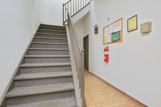 502 Central Ave Unit D1, Jersey City, NJ 07307 - stairway with a towering ceiling and baseboards