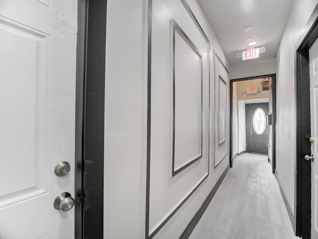 corridor featuring light hardwood / wood-style floors