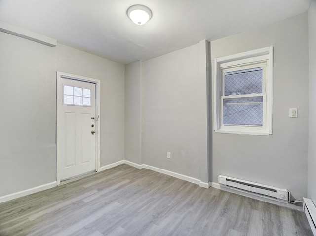 entryway with a baseboard radiator and light hardwood / wood-style floors