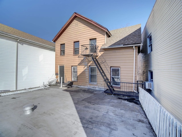 back of house featuring cooling unit and a patio area