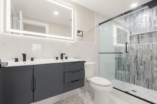 211 Summit Ave Unit 2, Jersey City, NJ 07304 - full bathroom with double vanity, tile walls, a stall shower, and recessed lighting