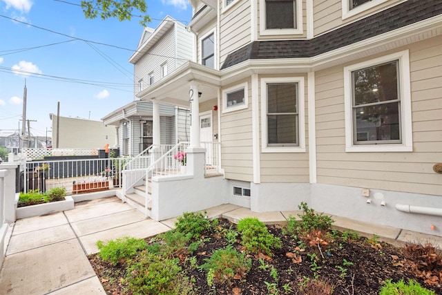 211 Summit Ave Unit 2, Jersey City, NJ 07304 - doorway to property with roof with shingles