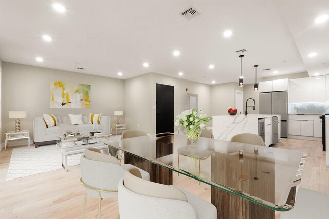 211 Summit Ave Unit 2, Jersey City, NJ 07304 - dining area featuring light wood-type flooring, recessed lighting, and beverage cooler