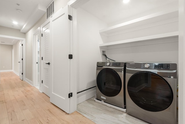 211 Summit Ave Unit 2, Jersey City, NJ 07304 - laundry room featuring washing machine and dryer, light wood-type flooring, and recessed lighting